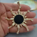 Retro gold sun pendant detail featuring sparkling cubic zirconia and a sleek black onyx center. - Black Agate Sun Pendant Only (Without Chain)