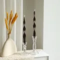 Detail view of 25cm twisted long pillar soy wax scented candle in glass holder for home decor. - Chocolate
