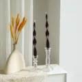 Detailed view of a 25cm twisted scented soy wax candle in glass holder for home decor. - Dark Red