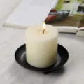 White pillar scented candle with black metal tray holder, cozy home decor atmosphere. - Black Tray