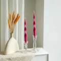 Detailed view of pink spiral scented candle set with glass holder for romantic home decor. - Rose Red