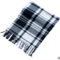 Detailed view of a classic black white grey plaid winter scarf with cozy fringe design. - Large White Plaid Scarf