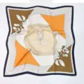 Detailed view of the elegant square silk scarf featuring chic geometric and floral line art. - Beige Colorblock Floral