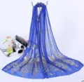 Royal blue sheer gauze scarf featuring elegant gold foil peacock feather prints for beach or daily wear. - Royal Blue Silk Scarf