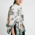 Detailed view of the elegant printed silk scarf featuring black bamboo and green border. - Ink Wash Bamboo Satin Scarves