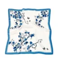 Detailed view of the blue and white floral silk scarf with elegant butterfly prints and borders. - Grape Blue