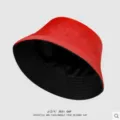 Detail shot of a trendy red and black reversible bucket hat, minimalist Japanese sun protection. - M (56-58cm) / Double-Sided Black and Red