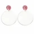 Close up of acrylic third grade earrings with glitter studs and colorful text design. - Third Grade Style