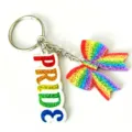 Colorful rainbow glitter bow and PRIDE letter acrylic keychain bag charm gift set. - Rainbow Bowknot with PRIDE Letters Style (1)