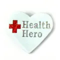 Close-up detail shot of heart shaped teacher brooch pin with glitter red cross and text. - White Heart Cross