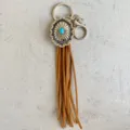 Western fringe keychain with turquoise concho, stylish cowboy leather bag charm accessory. - Brown