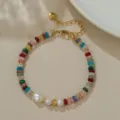 Detailed view of the colorful beaded bracelet featuring a baroque pearl and gold chain. Perfect. - B4128 Natural Pearl Colorful Abacus