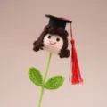 Handmade crochet graduation doll with black cap and red tassel, cute gift for graduation season. - Graduation Season Dolls for Girls