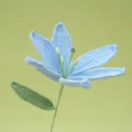 Handmade crochet blue lily flower close up detail shot of knitted floral gift! - Blue