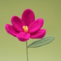 Handmade crochet pink flower variant with green leaf, soft yarn floral decor piece. - Rose Red