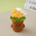 Handmade crochet potted flower detail showing cute smiling pot and yellow white blossoms. - Gradient Yellow