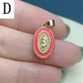 Close-up detail shot of oval pink enamel Our Lady of Guadalupe pendant, DIY jewelry accessory. - Pink