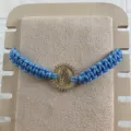 Blue woven rope bracelet with gold zircon Virgin of Guadalupe pendant, adjustable boho jewelry. - Sky Blue