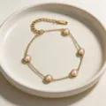 Minimalist gold plated titanium steel pearl bracelet, elegant daily wear jewelry accessory. - Bracelet
