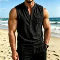 Close-up view of men's black sleeveless linen henley shirt with button pocket for summer beach. - S / Tops / Black