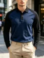 Close-up detail of men's long sleeve color-block polo shirt, casual golf lapel button style. - S / Navy Blue