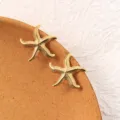 Golden starfish stud earrings detail view, vintage stainless steel jewelry accessory showcase. - Refined 3D Starfish (3#)