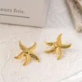 Close-up detail of golden starfish stainless steel stud earrings featuring textured surface finish. - Carved Texture Starfish (5#)