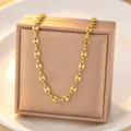 Gold titanium steel coffee bean chain necklace detailed view, elegant minimalist jewelry showcase. - Necklace / Gold