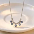 Silver evil eye pendant necklace detail shot, minimalist stainless steel jewelry for women. - Necklace / Steel