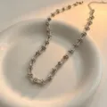 Stainless steel twist chain necklace with unique linked design, elegant silver finish for daily wear. - Necklace / Steel