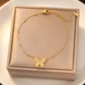 Gold titanium steel butterfly pendant clavicle chain necklace close-up view, delicate bead details. - Butterfly Bracelet