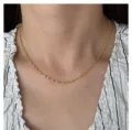 Detail shot of dainty 18k gold plated titanium steel twist rope chain necklace for women. - Water Ripple Chain