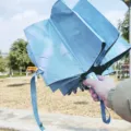 Compact 3-fold automatic sunscreen umbrella in light blue, UV protection for sunny and rainy days. - Sky Blue