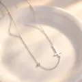Detailed view of silver titanium steel cross necklace with crystal pendant, elegant style. - Necklace / Steel
