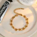 Trendy gold plated stainless steel twisted chain necklace for women, stylish minimalist jewelry. - Bracelet / Gold