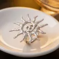 Close up view of the silver sun spiral ring showing intricate hammered texture and design. - Ring / Steel