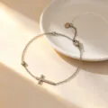 Minimalist titanium steel cross bracelet, delicate silver chain jewelry for everyday style. - Bracelet / Steel