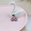 Detailed view of a cute purple cherry charm pendant with green leaf for DIY jewelry making. - Purple