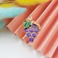 Detailed shot of creative DIY purple glitter grape enamel metal pendant charm for jewelry making. - Purple