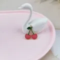Close-up detail shot of a cute red cherry enamel metal charm pendant for DIY jewelry making. - Red