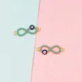 Gold evil eye infinity charm detail view for DIY handmade earrings and jewelry making. - Double Rings / 10 Pieces/Pack