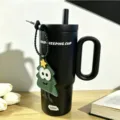 Stainless steel insulated coffee tumbler detail shot with straw, handle and Christmas tree pendant. - Twilight - Black 750ml [+ Christmas Tree Pendant]