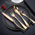 Luxury gold stainless steel flatware set, 4-piece knife fork spoon set for elegant dining. - Rose Gold