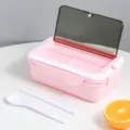Pink portable lunch box with compartments, tableware set, and leakproof lid for daily use. - Pink