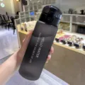 Large capacity frosted sports water bottle for students, stylish and durable plastic cup. - Matte Black