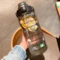 Large capacity sports water bottle with time marker, straw, and motivational quotes for fitness. - Transparent Black 2L Large Capacity