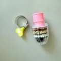Filtro acqua per rubinetto antispruzzo con filtrazione multistrato e fascetta. - Scatola Singola / Rosa
