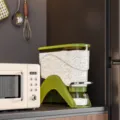 Groene plastic keuken rijst dispenser, verzegelde graan opslag container met knop. - S / Groen