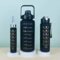 Motivational water bottle set of three black frosted plastic bottles with time markers for fitness. - Three-Piece Set / Dark Color