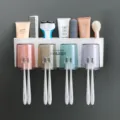 Wall-mounted toothbrush holder set with four cups and multiple slots for bathroom organization. - 4-Slot